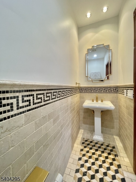 662 Foothill Road Bridgewater, NJ 08807 - Photo 18 of 46 a bathroom with a sink a mirror and a shower