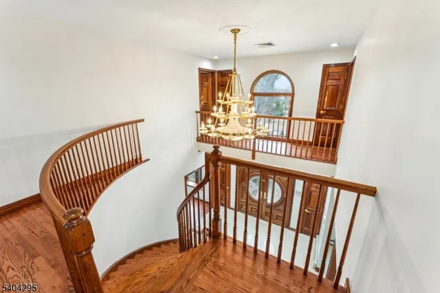 a large bathroom with a glass door shower and a sink
