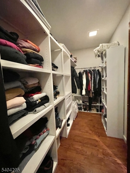 662 Foothill Road Bridgewater, NJ 08807 - Photo 25 of 46 a view of walk in closet with clothes and shoes