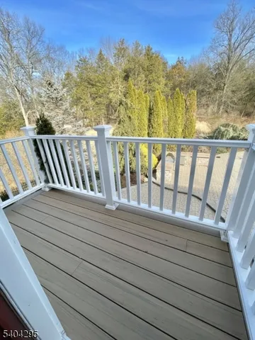 a large kitchen with stainless steel appliances kitchen island granite countertop a sink cabinets and window