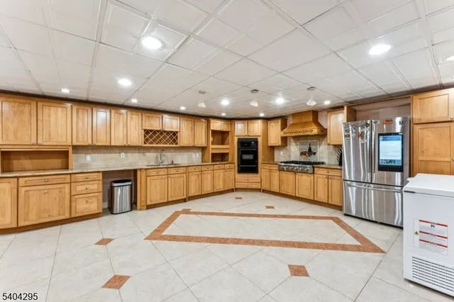 a front view of a house with yard covered in snow