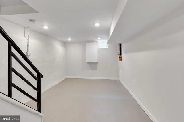 a view of an empty room with stairs