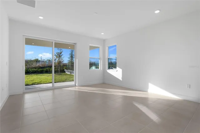 a view of empty room with floor to ceiling window