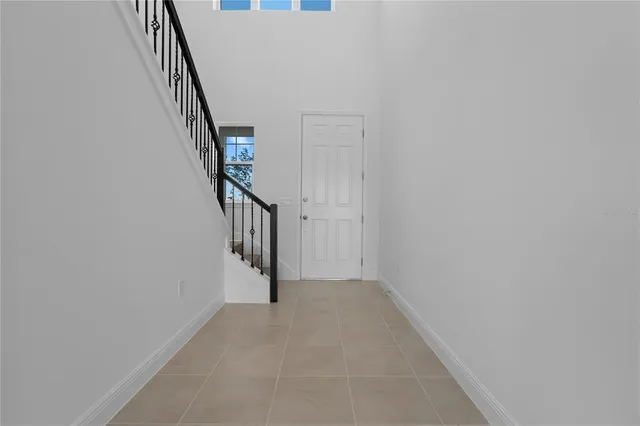 a view of a hallway with staircase