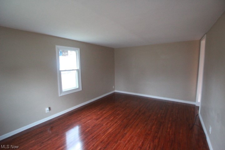 3606 Shelby Road Youngstown, OH 44511 - Photo 5 of 33 Unfurnished room featuring dark hardwood / wood-style flooring
