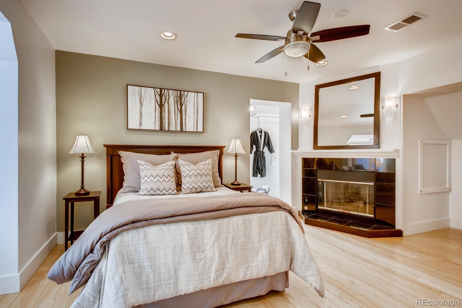 1635 Gilpin Street Denver, CO 80218 - Photo 15 of 39 a bedroom with a bed and a fireplace