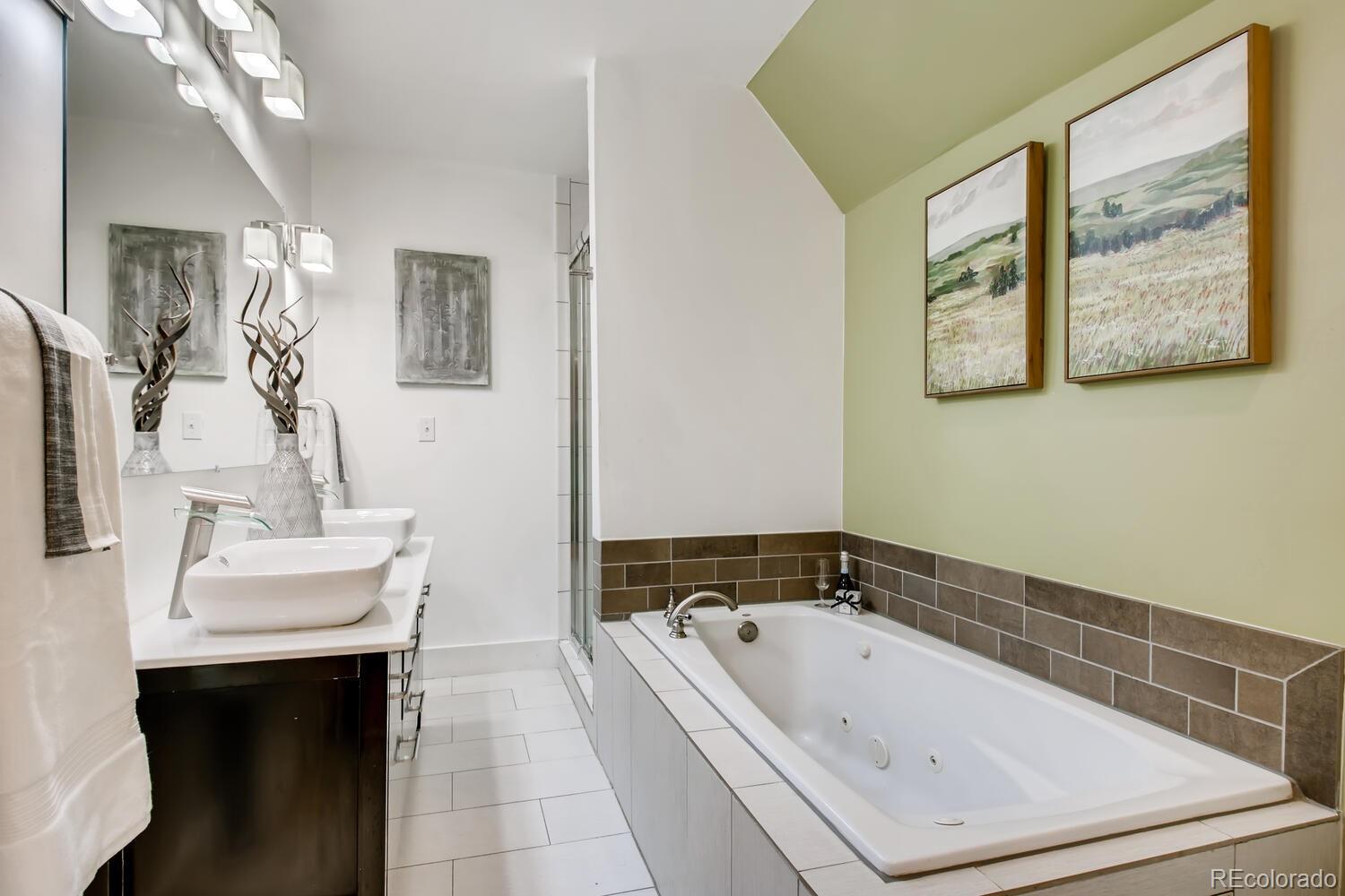 1635 Gilpin Street Denver, CO 80218 - Photo 18 of 39 a bathroom with a bathtub and a sink