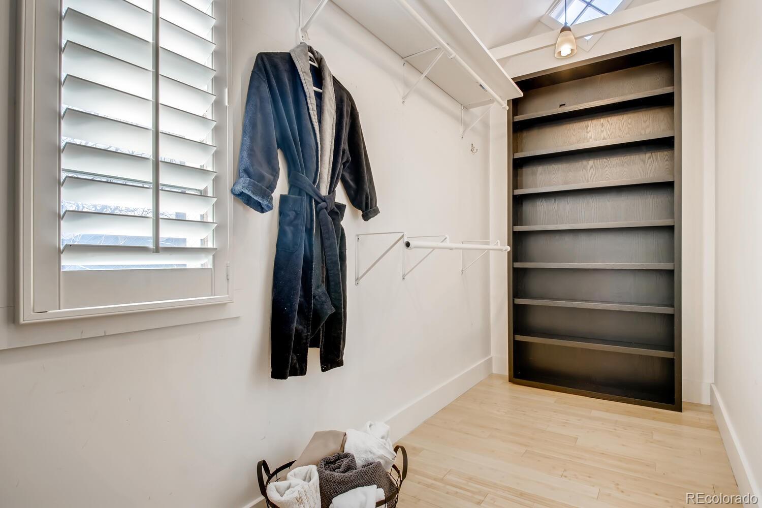 1635 Gilpin Street Denver, CO 80218 - Photo 19 of 39 a view of walk in closet with clothes and shoes