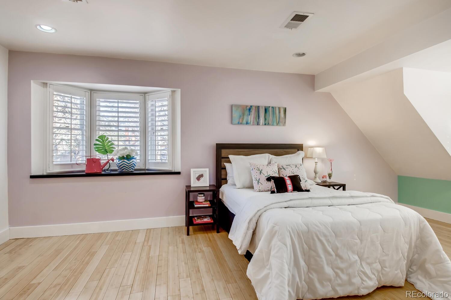 1635 Gilpin Street Denver, CO 80218 - Photo 20 of 39 a bedroom with a bed and a window