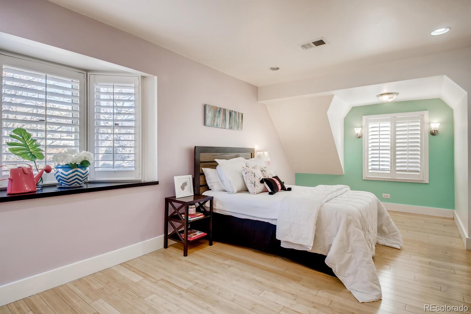 1635 Gilpin Street Denver, CO 80218 - Photo 21 of 39 a bedroom with a bed and a window