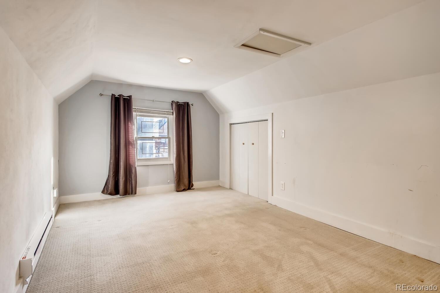 1635 Gilpin Street Denver, CO 80218 - Photo 31 of 39 an empty room with windows and closet