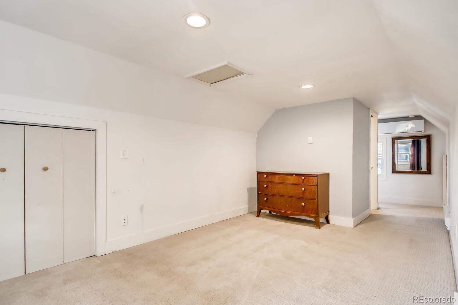 1635 Gilpin Street Denver, CO 80218 - Photo 32 of 39 an empty room with a window and a ceiling fan