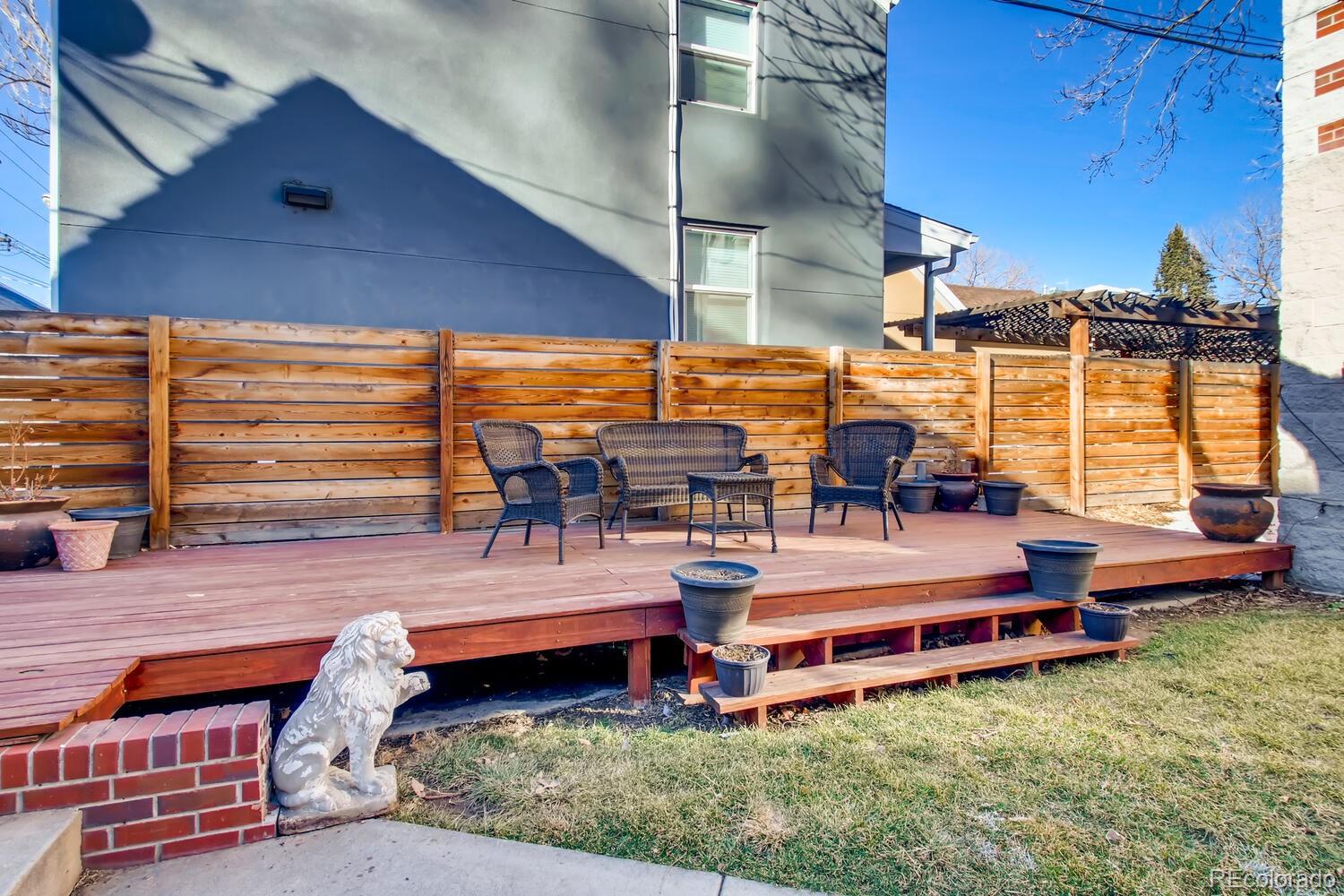 1635 Gilpin Street Denver, CO 80218 - Photo 34 of 39 a view of a chairs and table in the patio