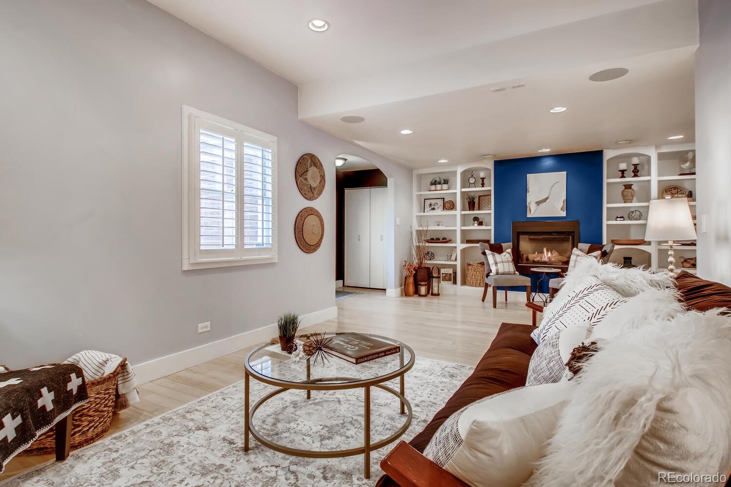 1635 Gilpin Street Denver, CO 80218 - Photo 6 of 39 a living room with furniture a fireplace and a window