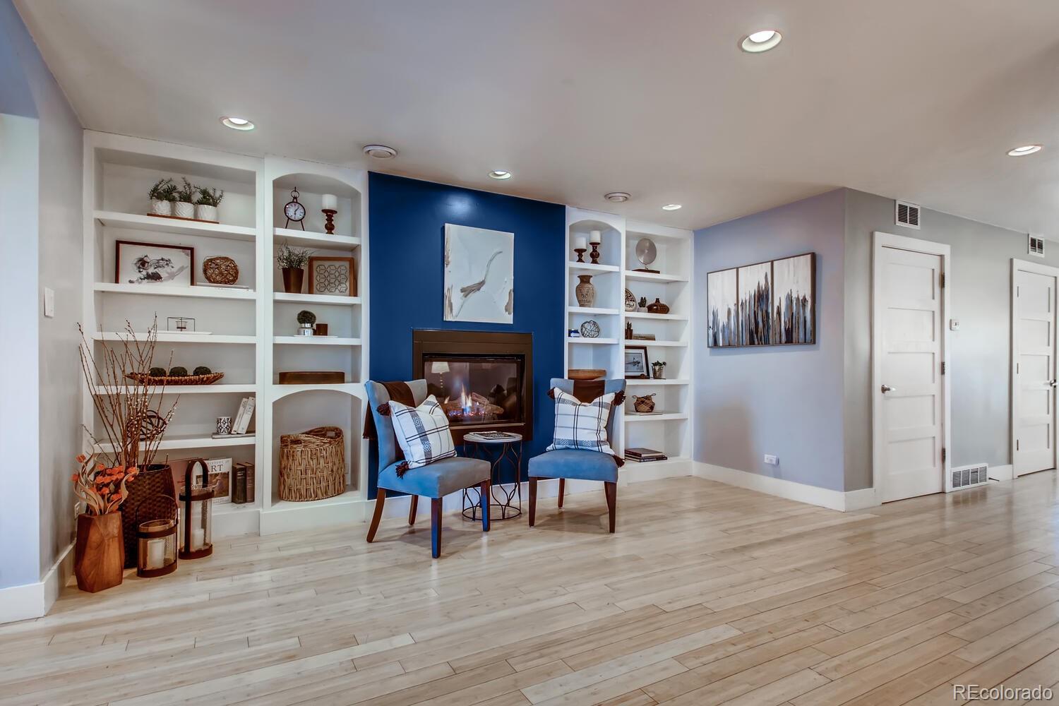 1635 Gilpin Street Denver, CO 80218 - Photo 7 of 39 a living room with furniture and a fireplace