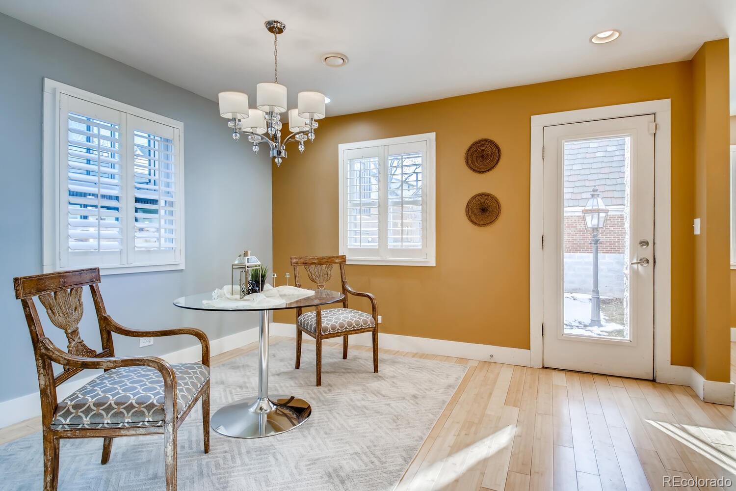 1635 Gilpin Street Denver, CO 80218 - Photo 8 of 39 a view of a dining room with furniture and chandelier
