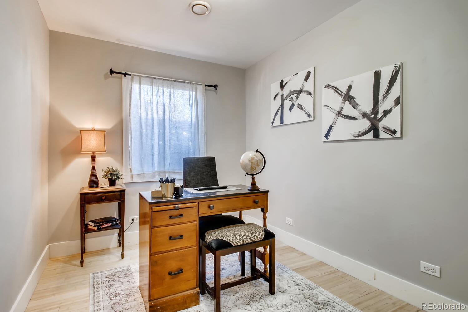 1635 Gilpin Street Denver, CO 80218 - Photo 9 of 39 a view of a workspace with furniture and a window