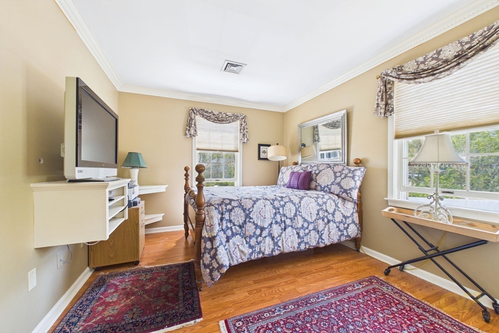 700 Shore Drive, Unit 509 Fall River, MA 02721 - Photo 16 of 25 a bedroom with a bed and glass windows