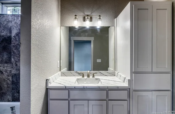 a view of hallway with wooden floor