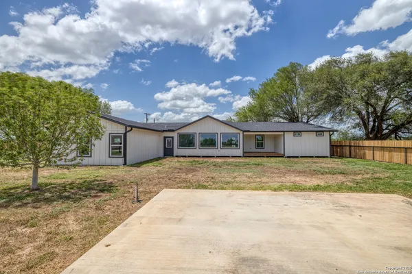 a view of a house with a big yard