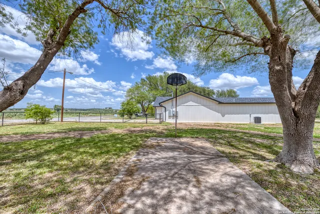 a view of a lake with houses in the back