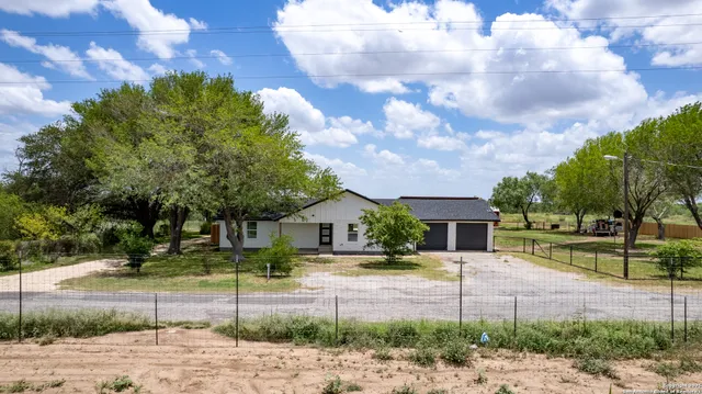 a view of a yard with an trees
