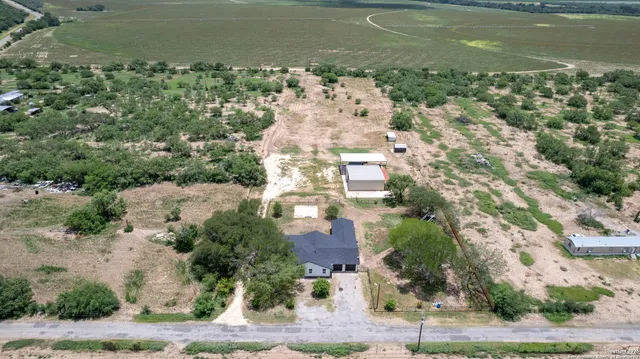 a view of a house with yard and a garden