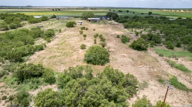 a view of a yard in front of house with outdoor seating