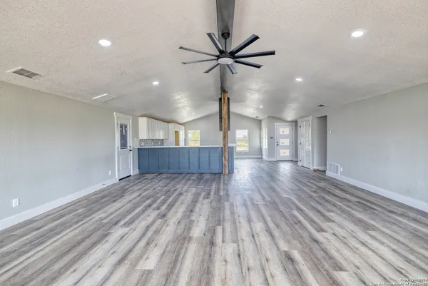 a view of wooden floor and staircase in a room