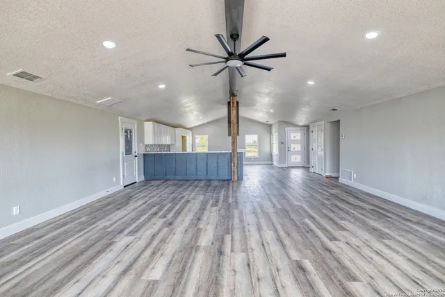 a view of wooden floor and staircase in a room