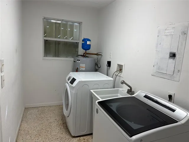 a utility room with dryer and washer
