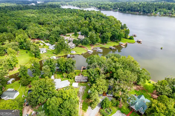 an aerial view of a houses with a lake view