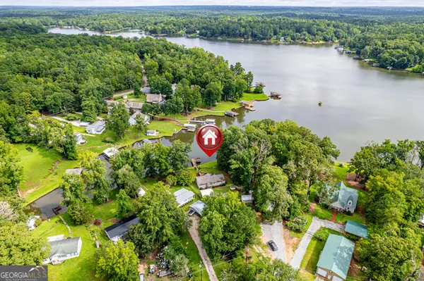 an aerial view of a houses with lake view