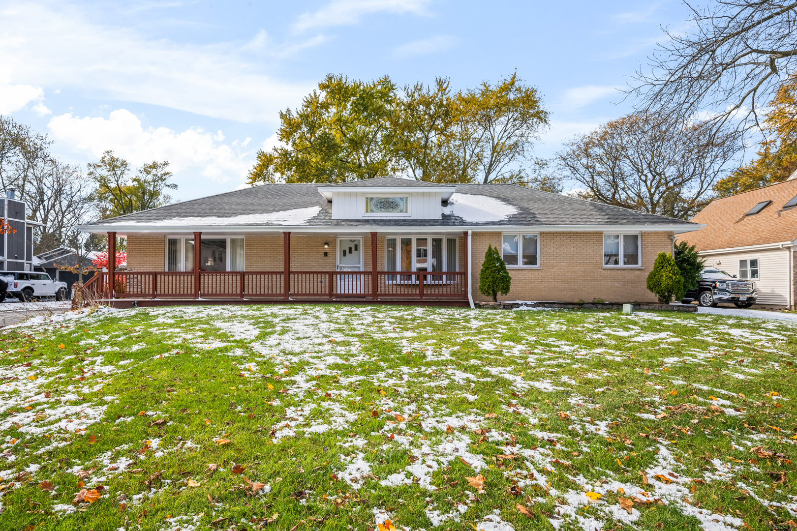 a view of a house with a garden and yard