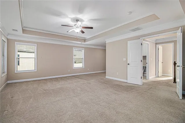 a spacious bathroom with a tub sink and mirror