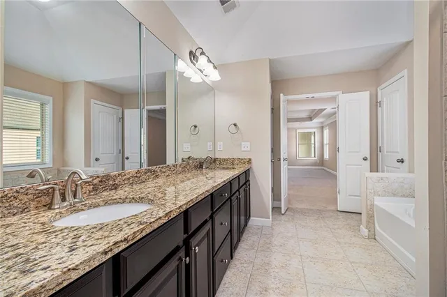 a view of a livingroom with a window and a ceiling fan