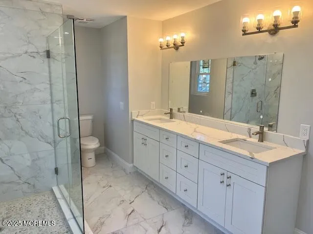 a spacious bathroom with double sink and a mirror