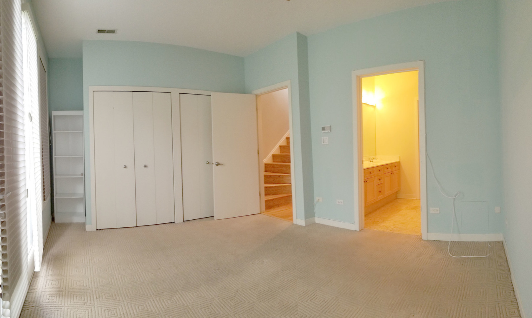 1229 West Madison Street, Unit Q Chicago, IL 60607 - Photo 15 of 32 a view of an empty room with a window