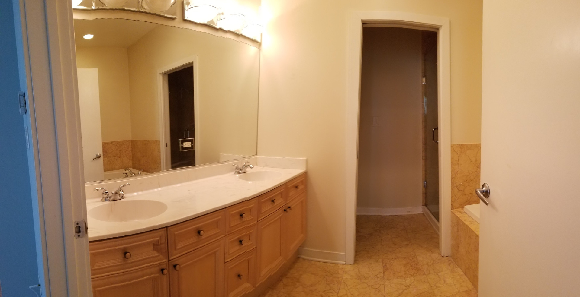 1229 West Madison Street, Unit Q Chicago, IL 60607 - Photo 21 of 32 a bathroom with a granite countertop sink and a mirror