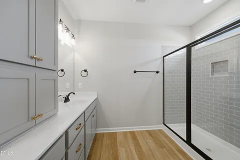 a bathroom with a sink and mirror