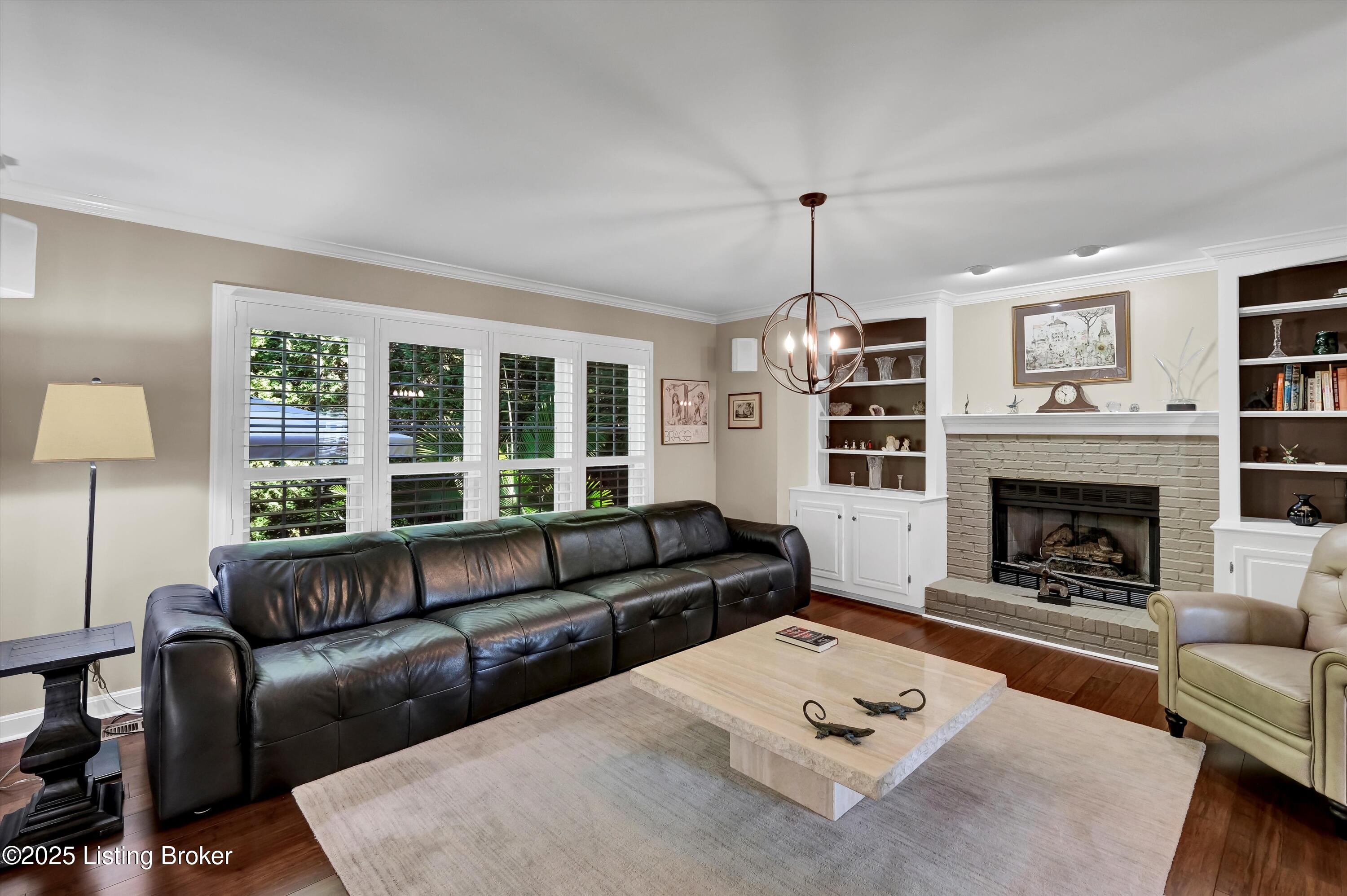 10612 Edgewater Road Louisville, KY 40223 - Photo 5 of 55 Great Room with Book Cases and Fireplace