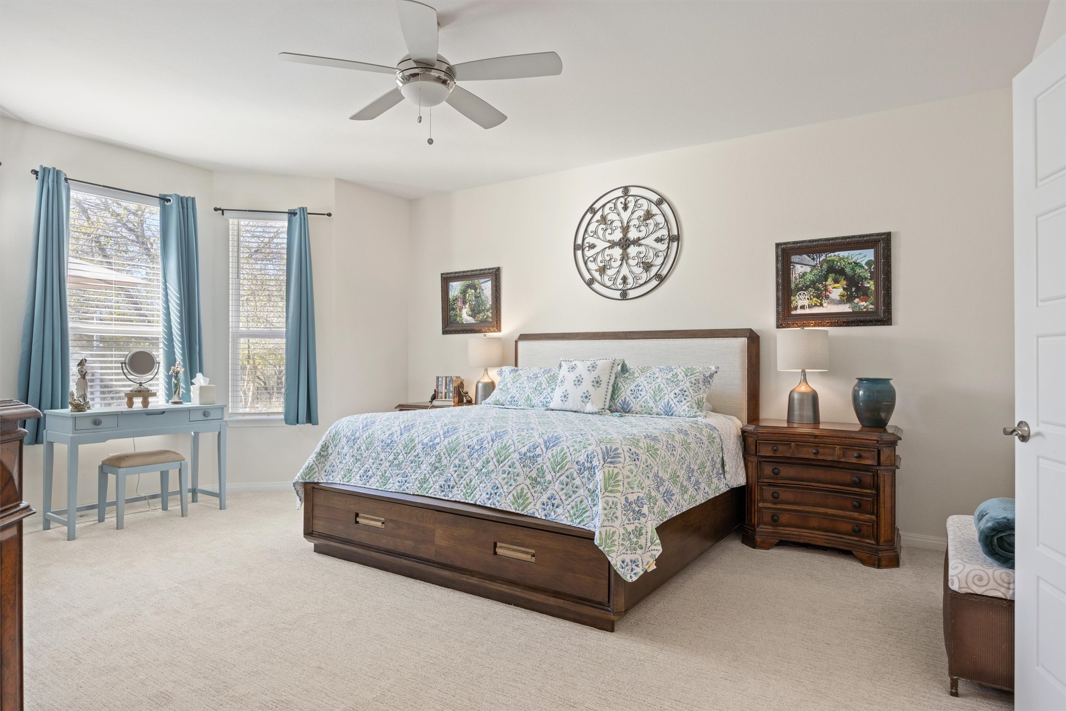 210 Raptor Beak Way Cedar Creek, TX 78612 - Photo 11 of 36 a spacious bedroom with a bed a table and a large window