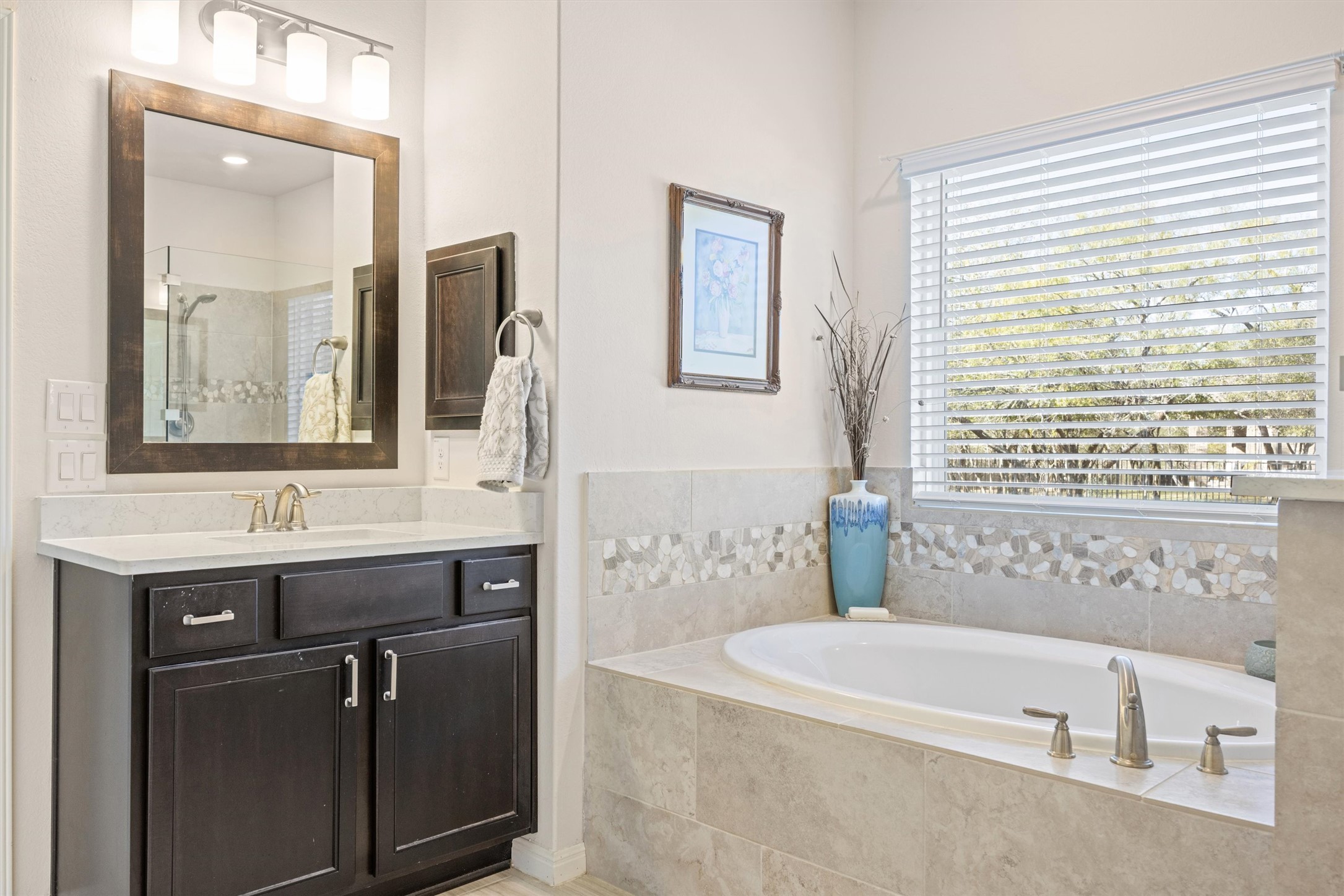210 Raptor Beak Way Cedar Creek, TX 78612 - Photo 15 of 36 a bathroom with a bathtub and a sink