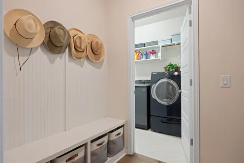 a living room with furniture rug and window
