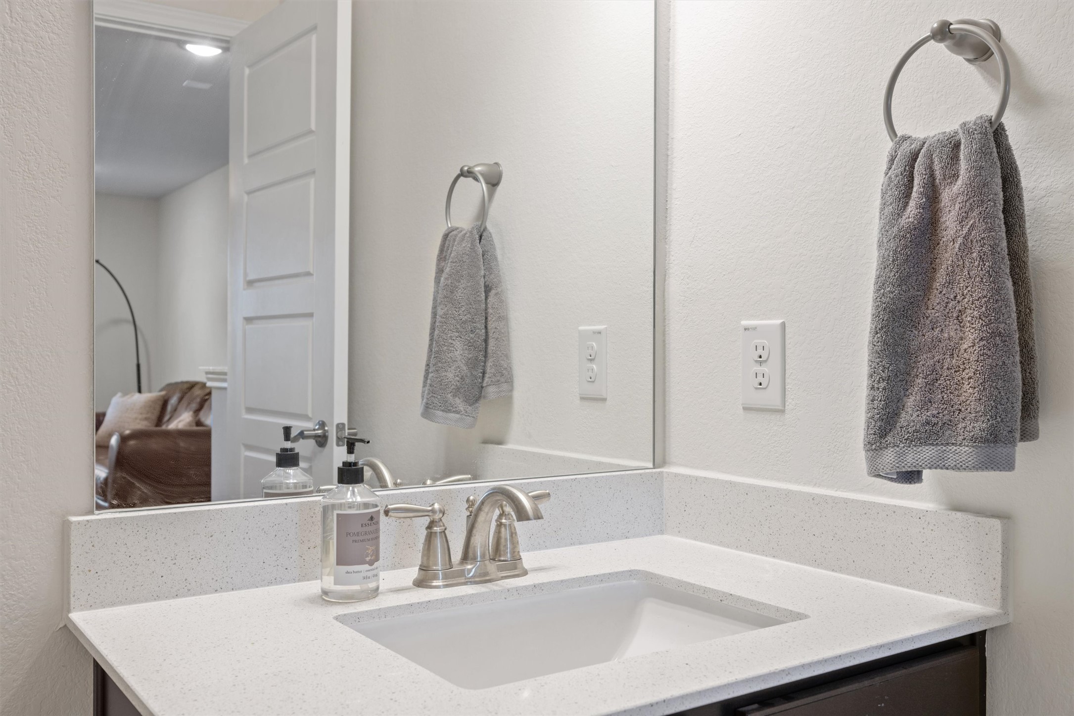 210 Raptor Beak Way Cedar Creek, TX 78612 - Photo 30 of 36 a bathroom with a sink and a mirror