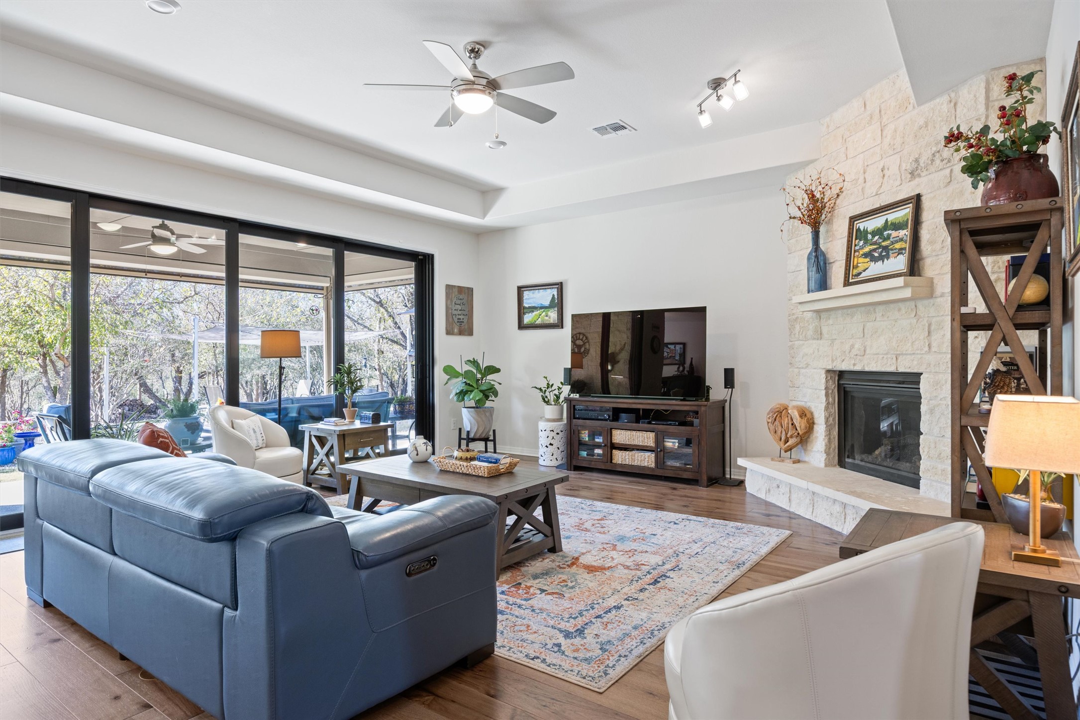 210 Raptor Beak Way Cedar Creek, TX 78612 - Photo 5 of 36 a living room with fireplace furniture and a flat screen tv