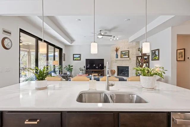 a kitchen with a sink and a large window