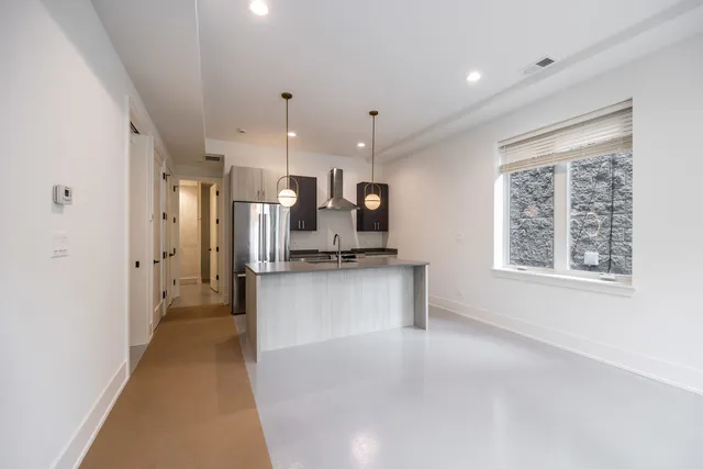 a view of a kitchen with a oven and cabinets