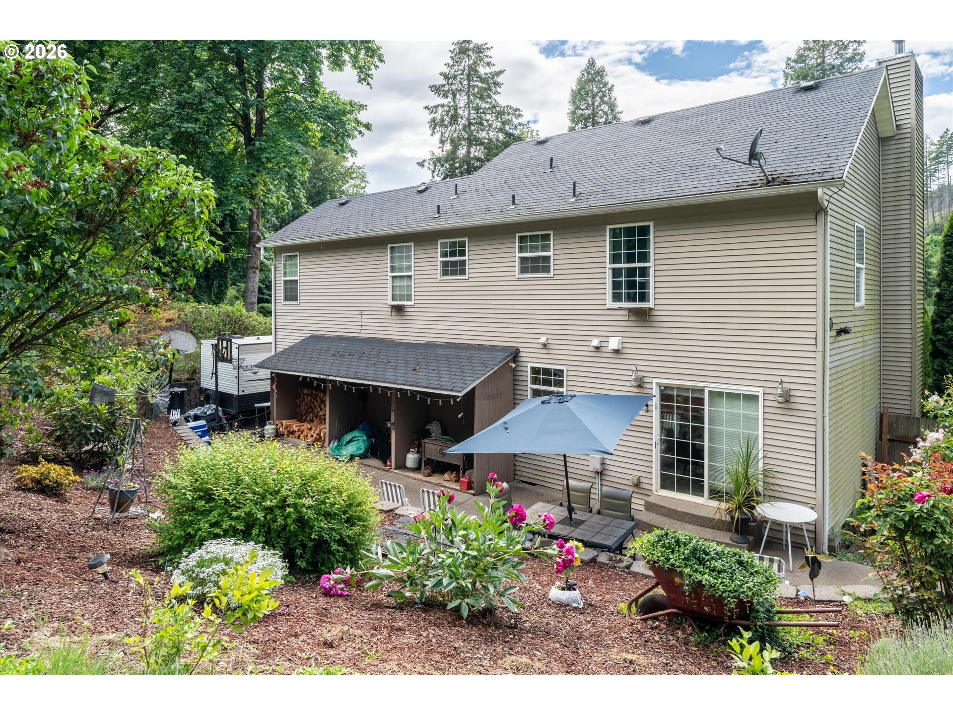 91051 Leashore Drive Vida, OR 97488 - Photo 23 of 36 a front view of a house with a garden