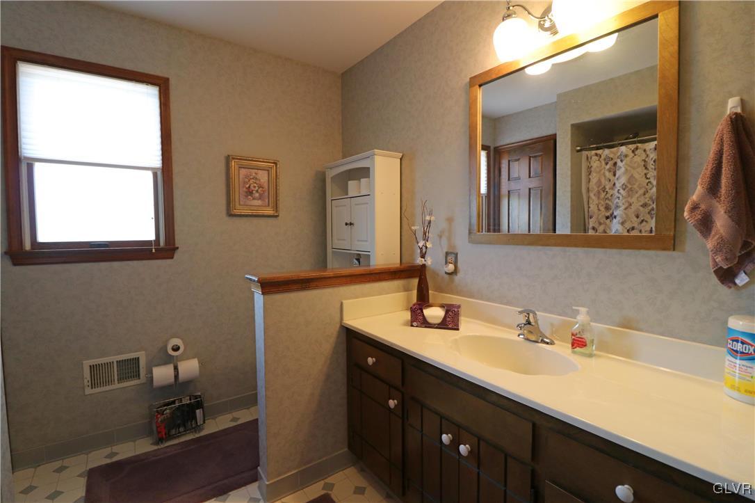 103 James Way Road Bath, PA 18014 - Photo 24 of 50 a bathroom with a sink and a mirror